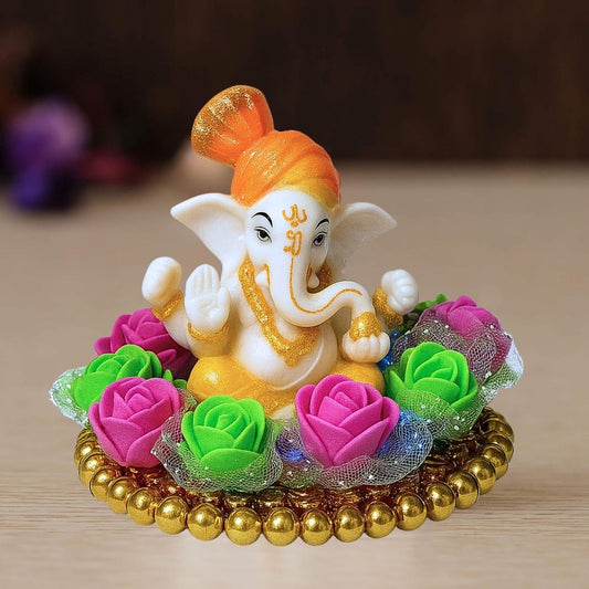Tiny Shiny Lord Ganesha Idol on Colorful Flower Plate  with Gold Beads