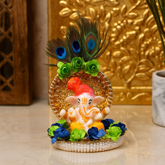 Tiny Shiny Lord Ganesha Idol with Real Peacock  Feathers and Golden Disc Plate